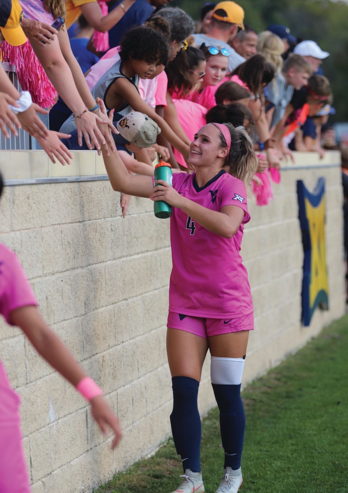 Bianca St. Georges celebrating with fans after a 2-1 win over Texas.